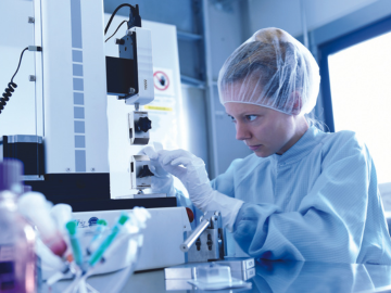 A laboratory worker at work with test equipment